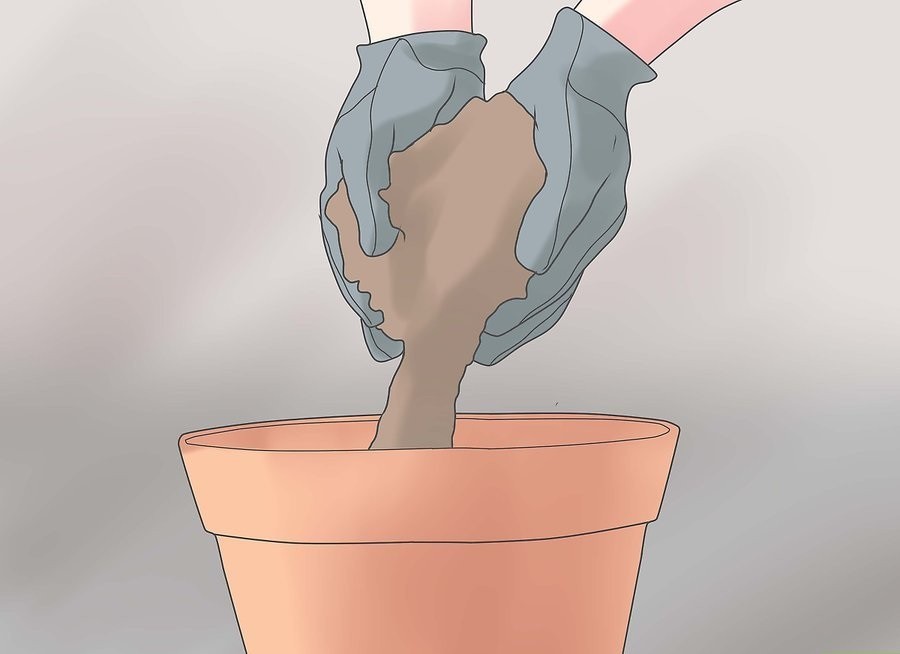 выкладывание почвы в горшок